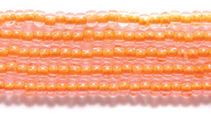 11SB734-N: CZ Seed Bead Neon Lined Orange 11/0 Uv Reactive 6HK