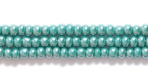 11SB386: CZ Seed Bead Sfinx DK Green 11/0 6HK