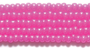 10SB692-DY: CZ Seed Bead Dyed Pink On Alabaster 10/0 5HK