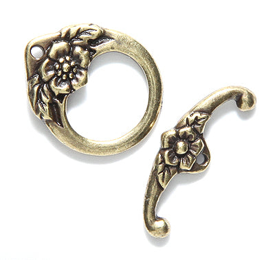 TC6196-AB: Toggle Clasp Floral 22mm Ant Brass