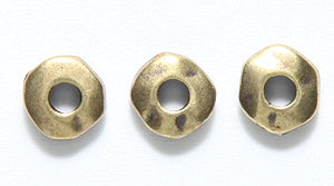 TC0450-AB: Nugget Heishi 7mm 2 ID Ant Brass 10PC