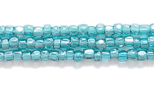 9SC387-TR: CZ Seed Bead 3-cut Trans DK Emerald Luster 9/0-1HK