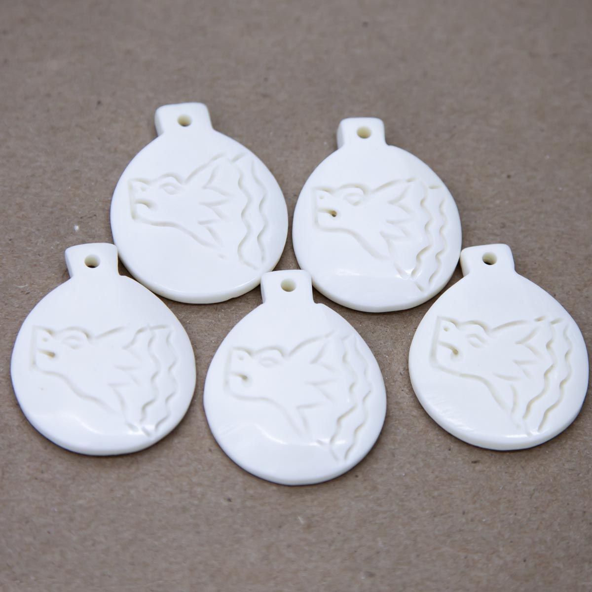 BN385-92: Bone Wolf Head Pendant White 44x35mm - 5 Pieces