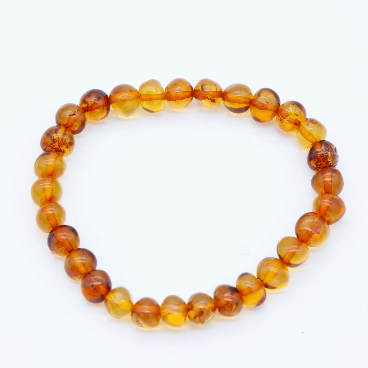 1AC925-B1: Amber Stretch Bracelet Round Nuggets Honey