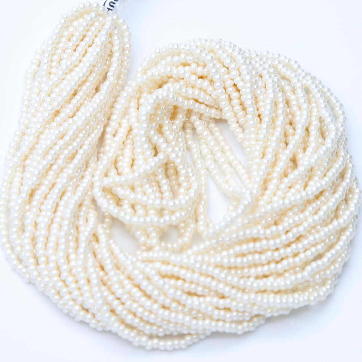 10SB651R: CZ Seed Bead Lt Eggshell 10/0 1 Hank