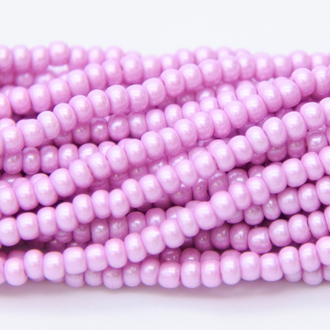 8SB696-AR: CZ Seed Bead Silk DK Pink/Violet 8/0 1 Hank