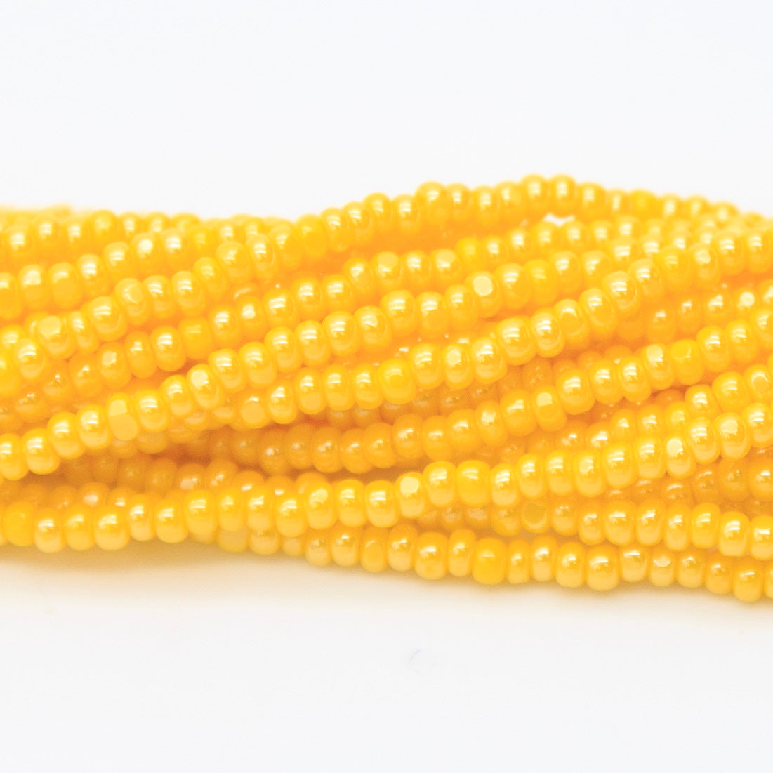 11SB326-CR: Czech Seed Bead True Cut Sfinx Dark Yellow 11/0