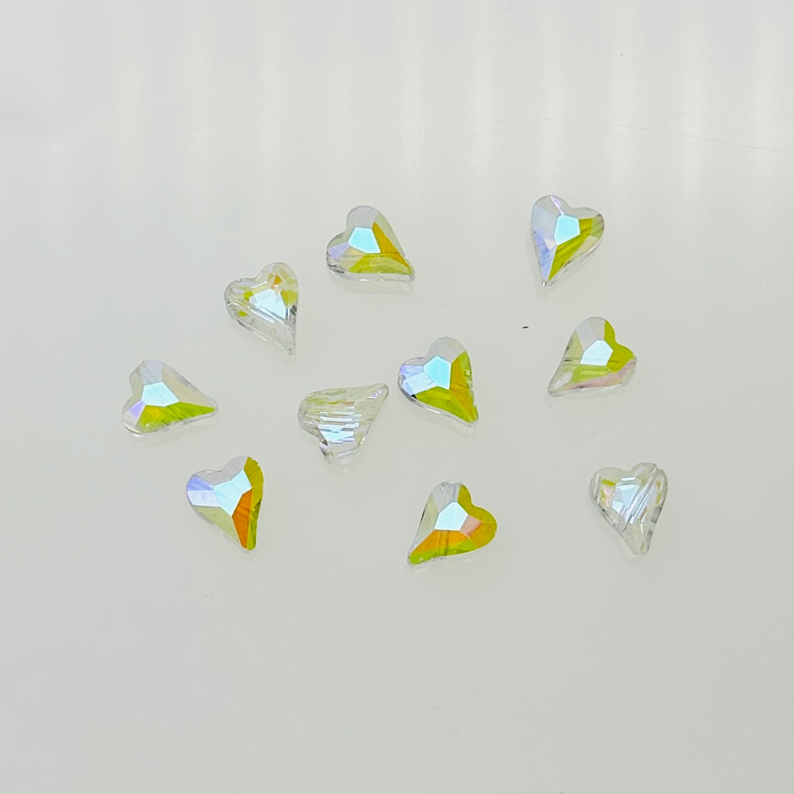 10HT512-D: FC Heart Bead Cry AB Diagonal Hole 10x12mm - 10PC